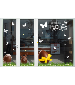 photo-vitrine-paques-boulangerie-patisserie-oeufs-lapin-chocolat-ruban-jaune-fleurs-papillons-herbes-etageres-suspensions-texte-joyeuses-paques-vitrophanie-electrostatique-sans-colle-repositionnable-DECO-VITRES